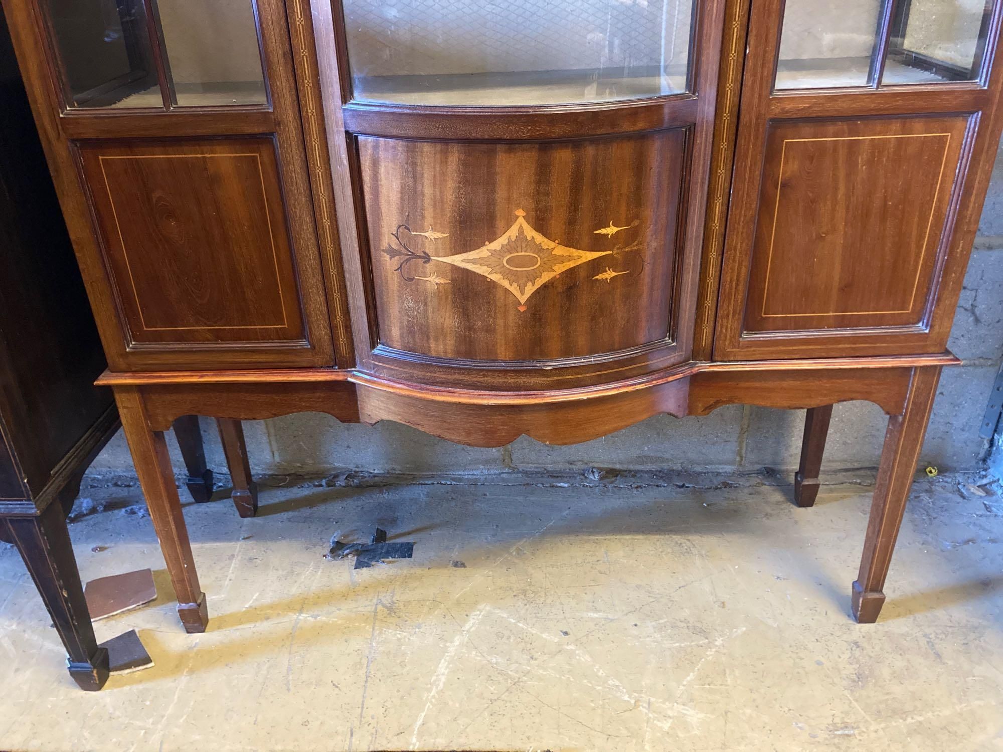 An Edwardian inlaid mahogany bow fronted china display cabinet, width 114cm height 191cm